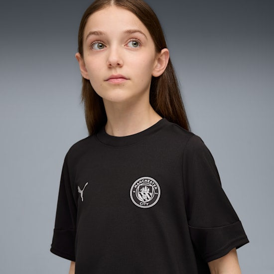Puma Manchester City training shirt jeugd 2025 2026 met officieel clublogo en DryCELL technologie.